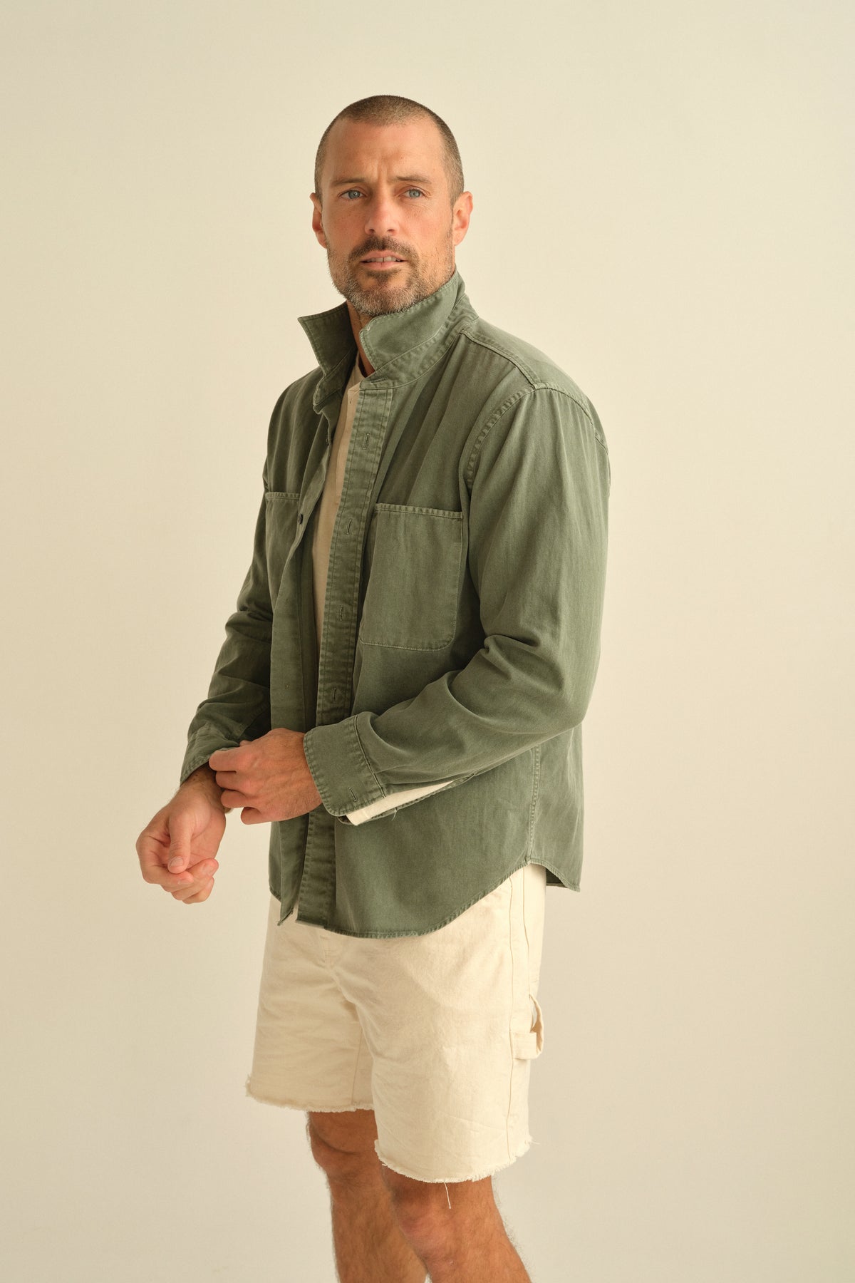 Olive green twill work shirt with chest pocket and button-front placket