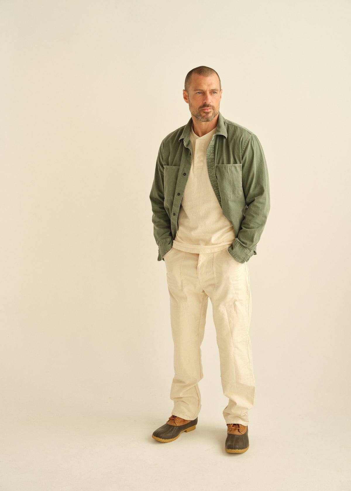Natural drill dungaree pants with straight legs and stitched panel seams