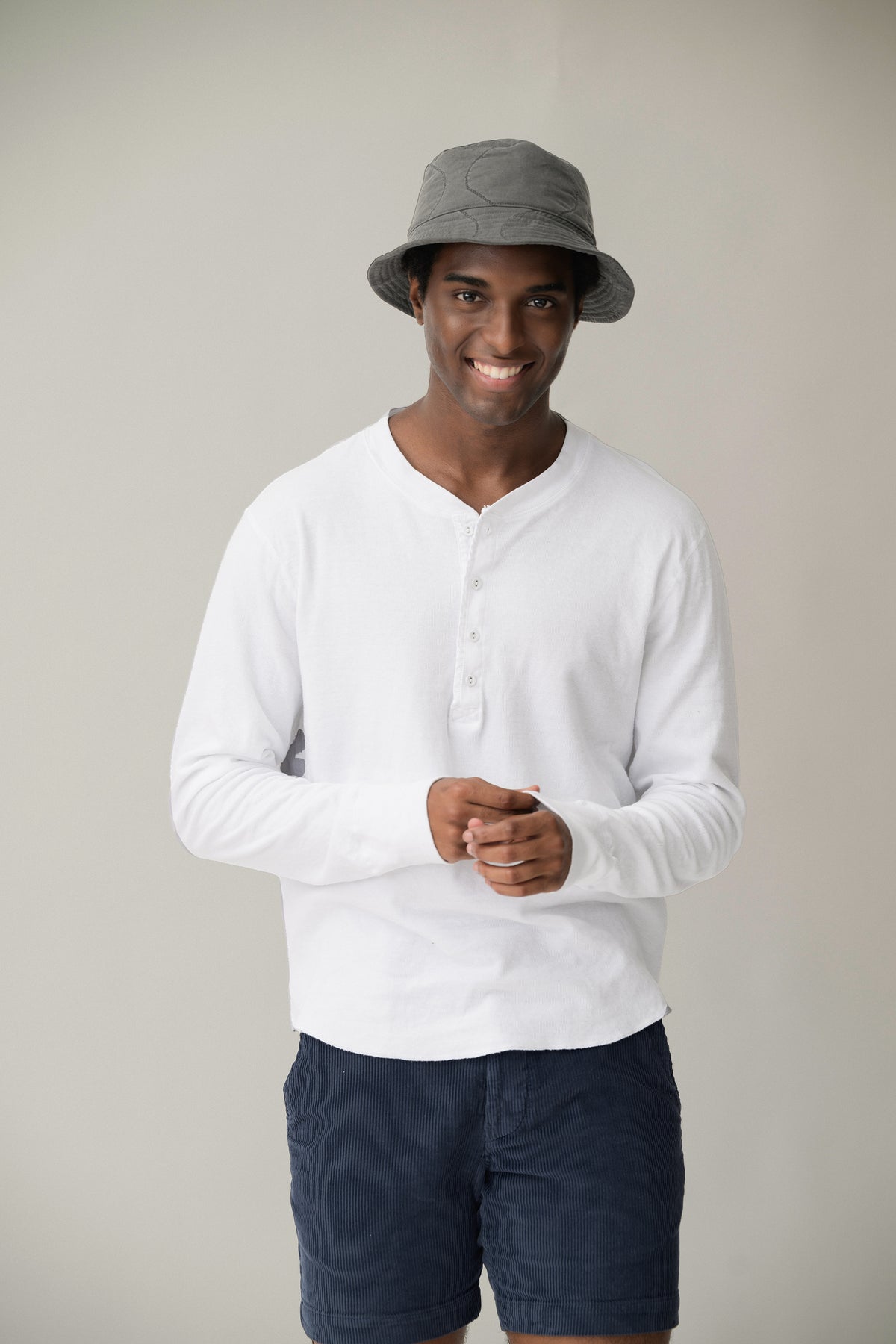 White long-sleeve henley shirt with button placket