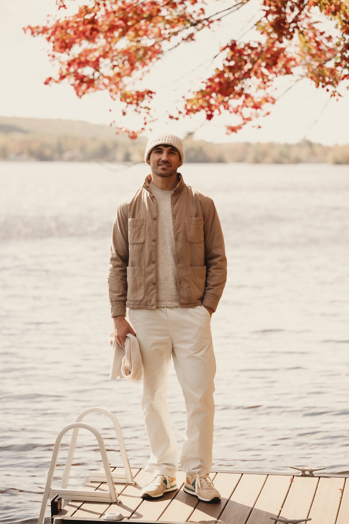 Beige shirt jacket with button front and two flap pockets
