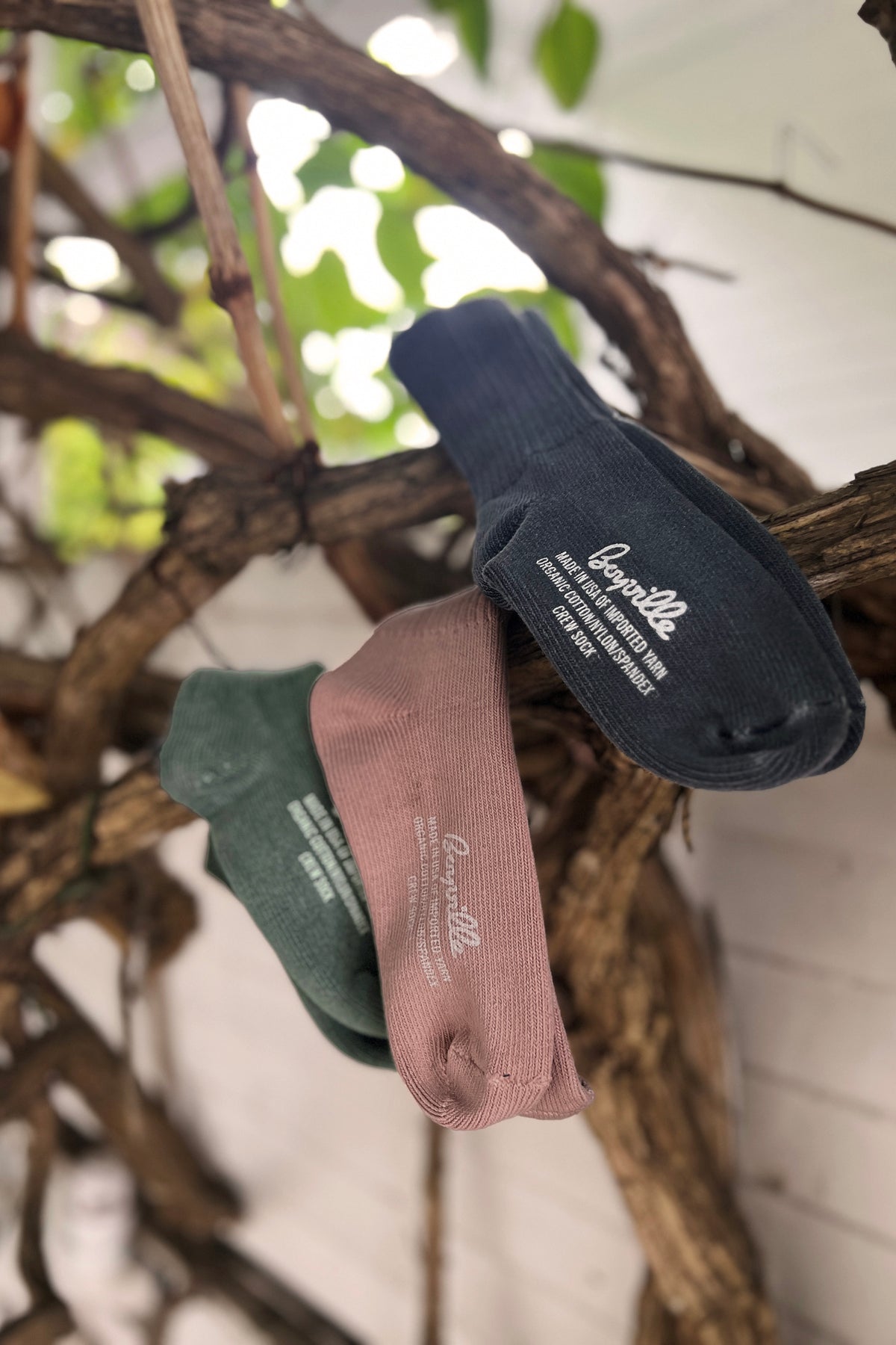 Hanging crew socks in dark blue, green and pink, ribbed cuffs