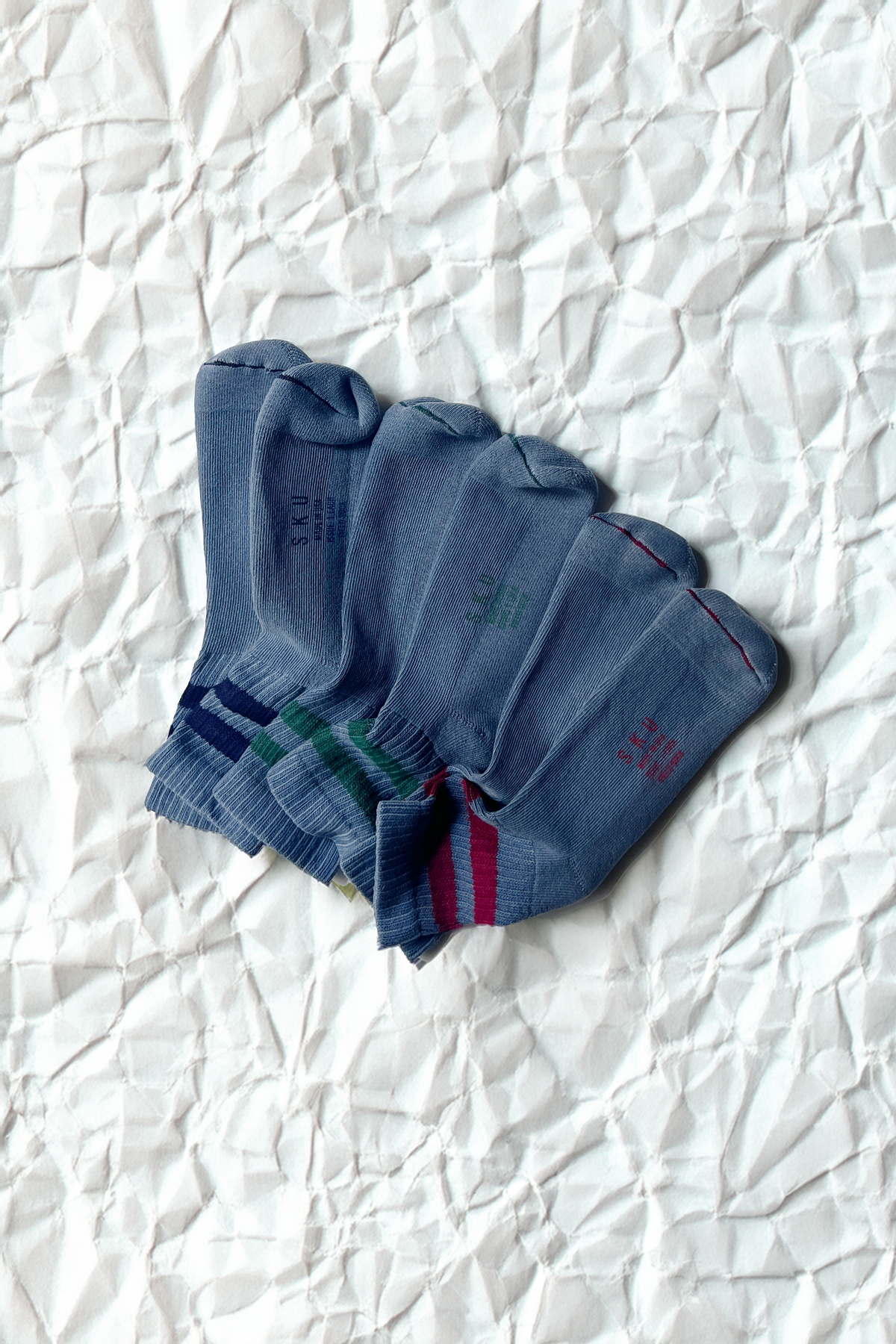 Crew socks in blue with ribbed cuff and green and red stripe detail