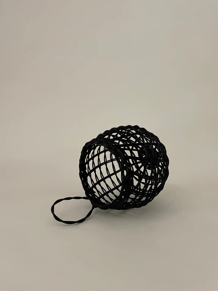 Sweet onion basket with open weave net and long loop handle, dark color.