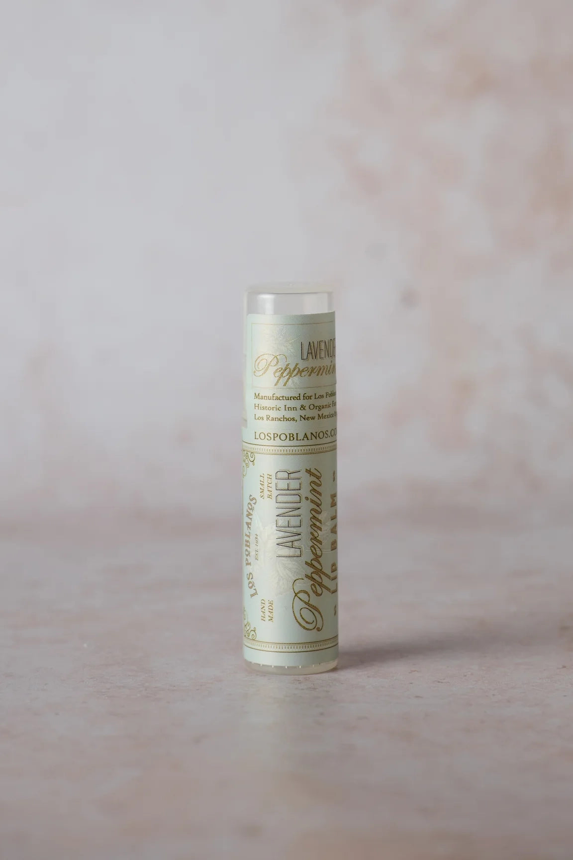 Los Poblanos Lavender Peppermint lip balm tube, white cylindrical container