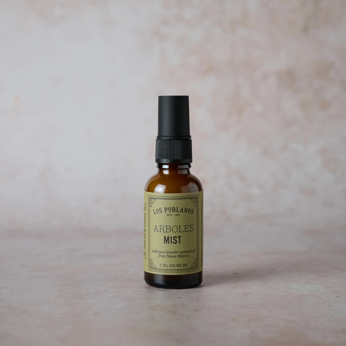 Los Poblanos Arboles mist spray bottle with black pump and amber glass