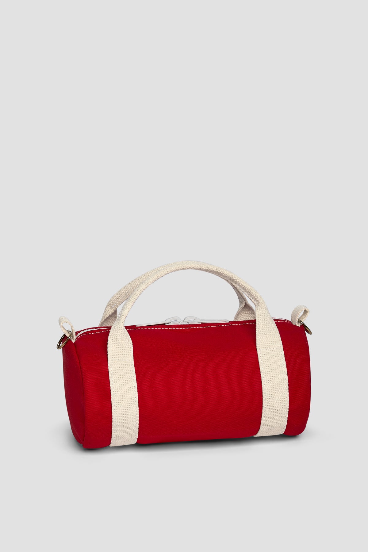 Red duffel kit bag with white stripe, top handles, zip closure, side logo patch