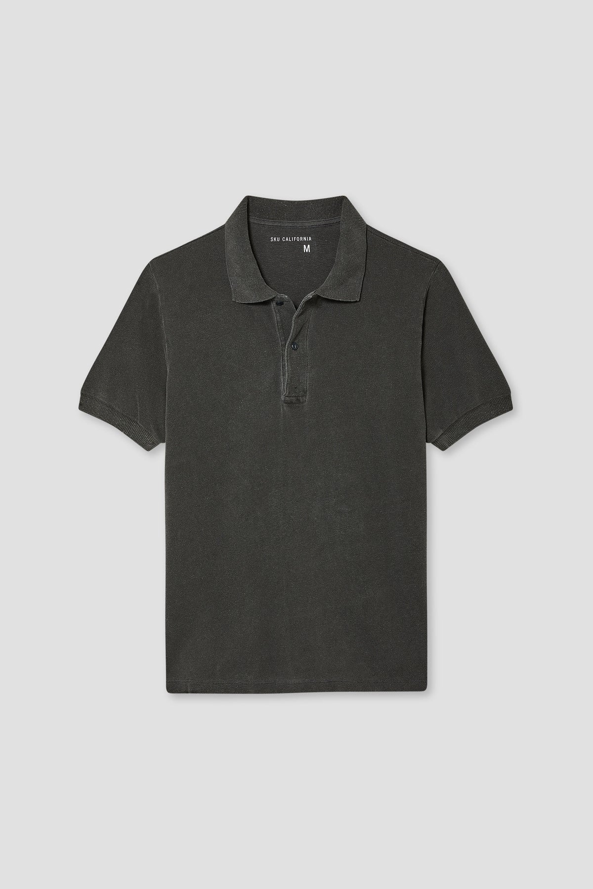 Faded black cotton-hemp pique polo with ribbed collar and button placket