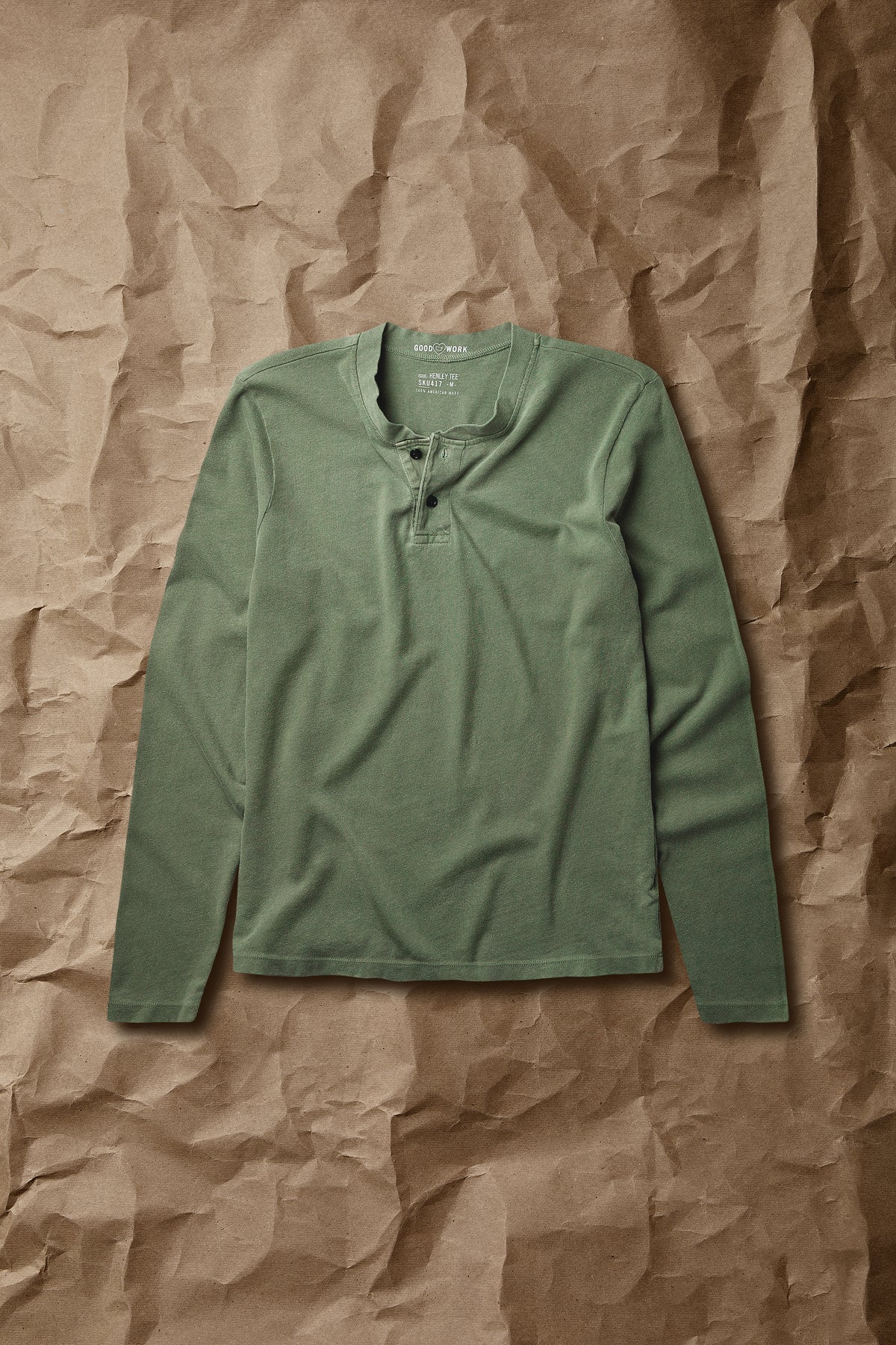 Green long-sleeve jersey henley top with button placket