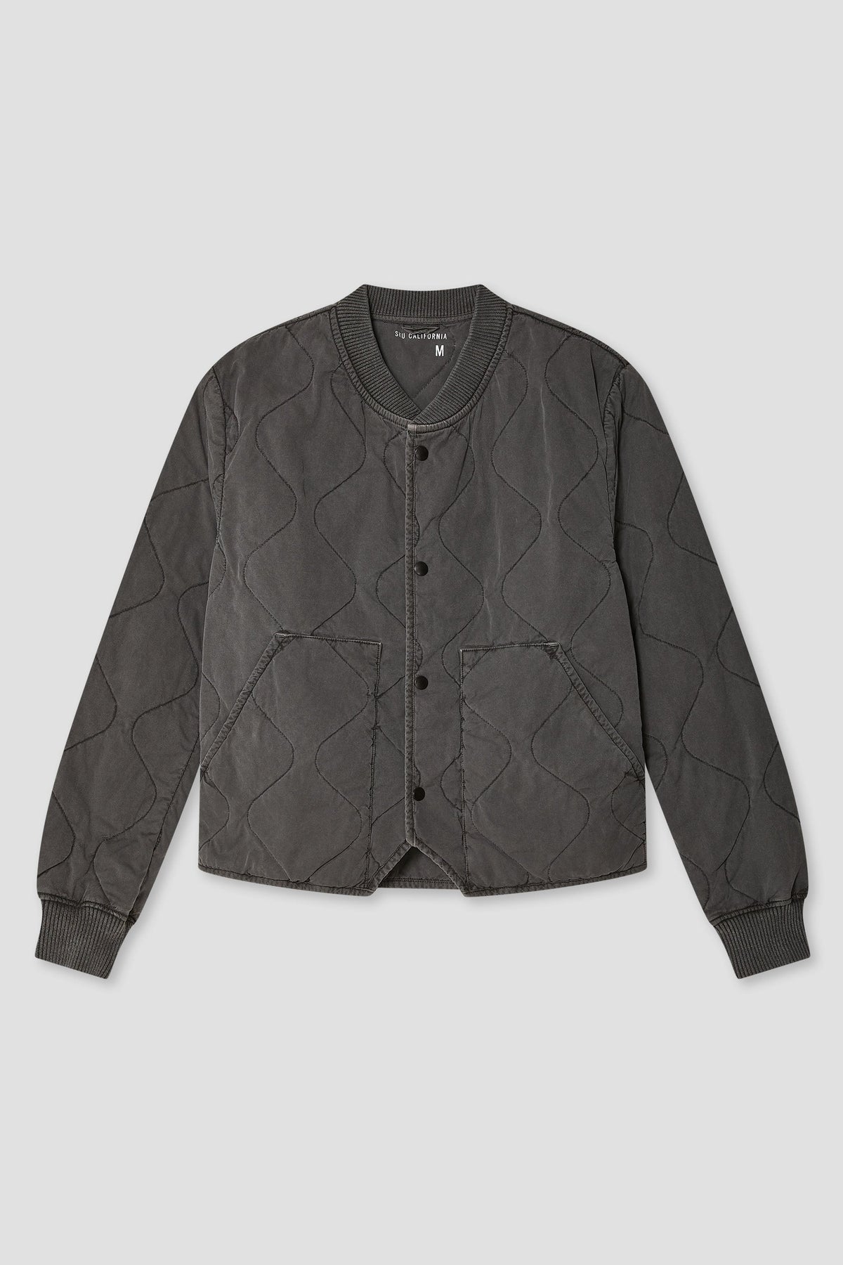 Quilted bomber jacket in dark gray/black with ribbed cuffs and button front