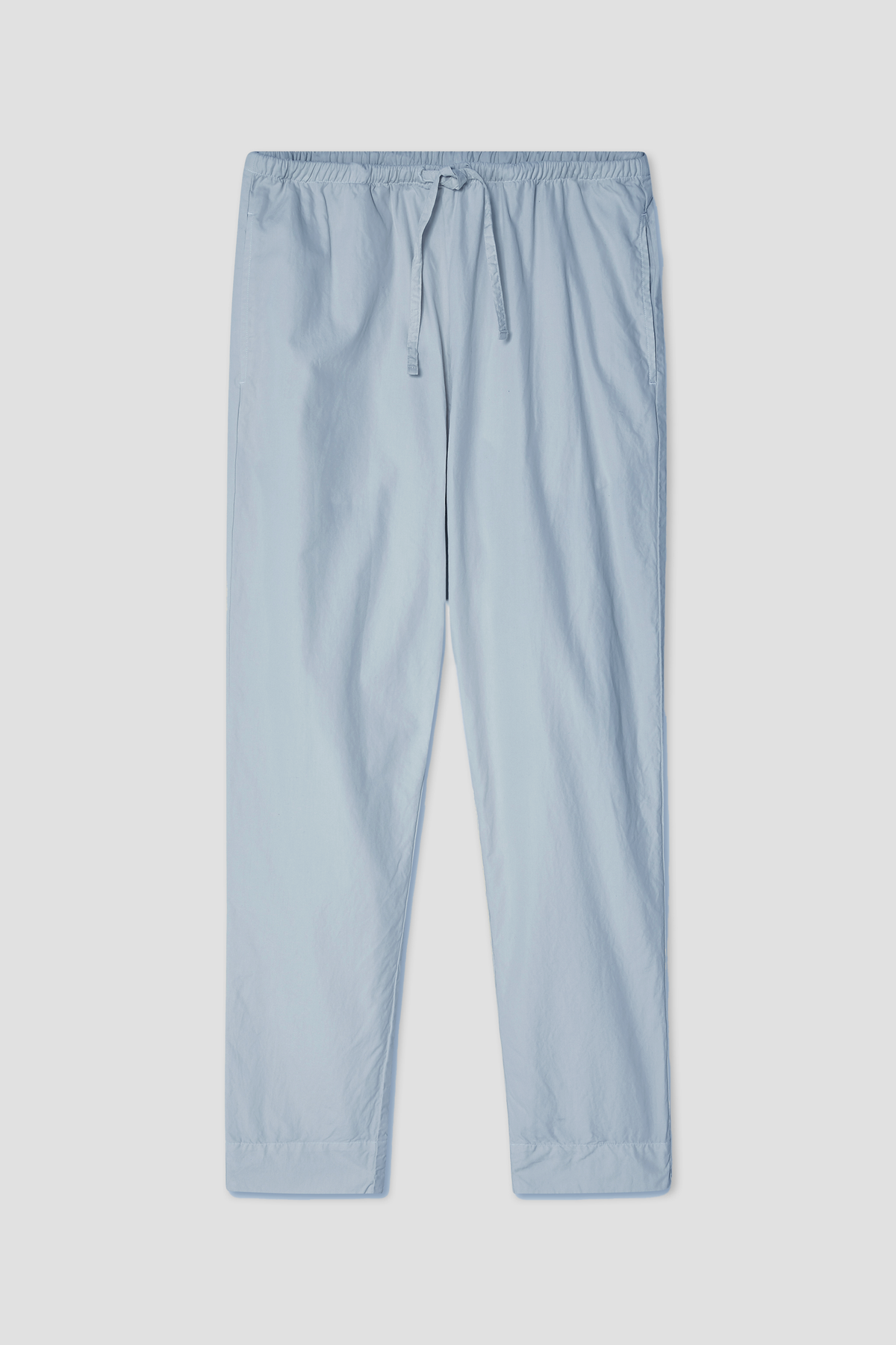 Light blue poplin drawstring pants with elastic waist and tapered straight legs