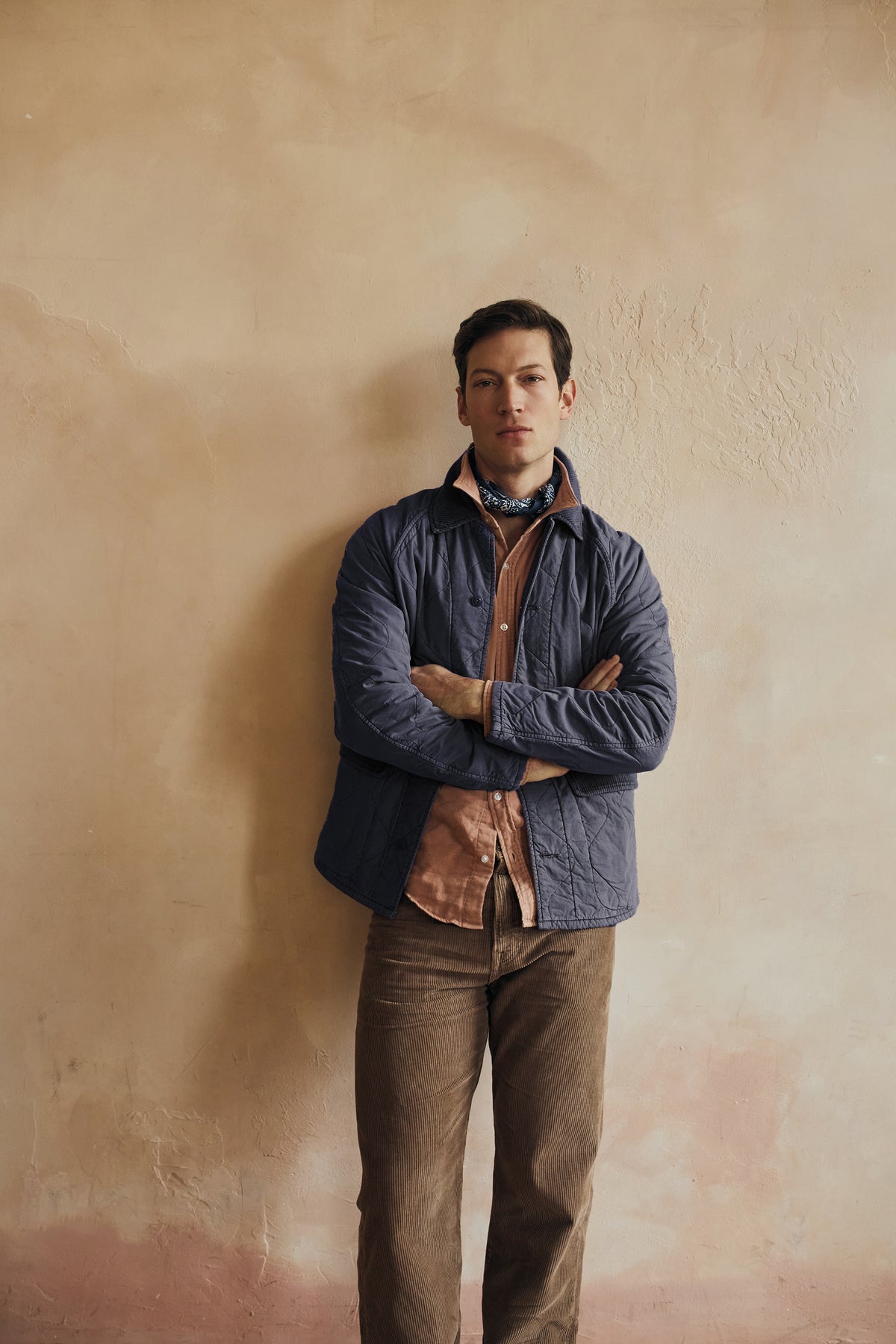 Five-pocket corduroy jeans worn with a straight-leg fit in a muted brown shade