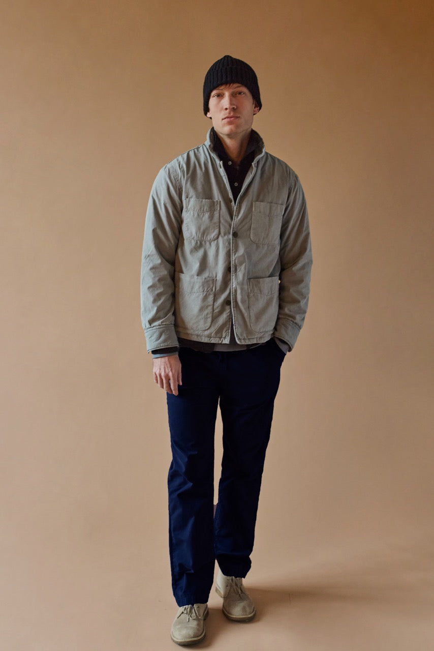 Dark navy corduroy chino pants with elastic waistband and drawstring on model
