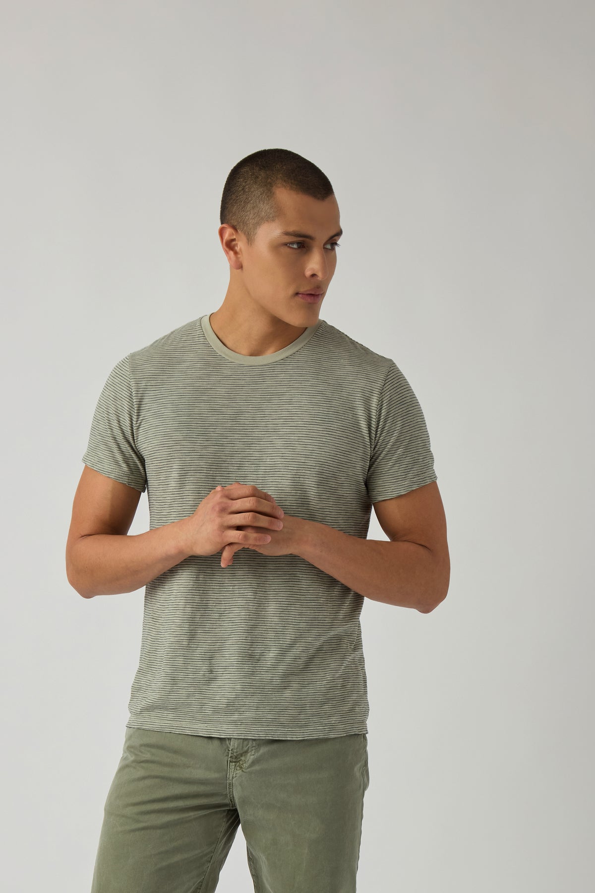 Heather gray jersey T-shirt with crew neck and short sleeves, worn by a model