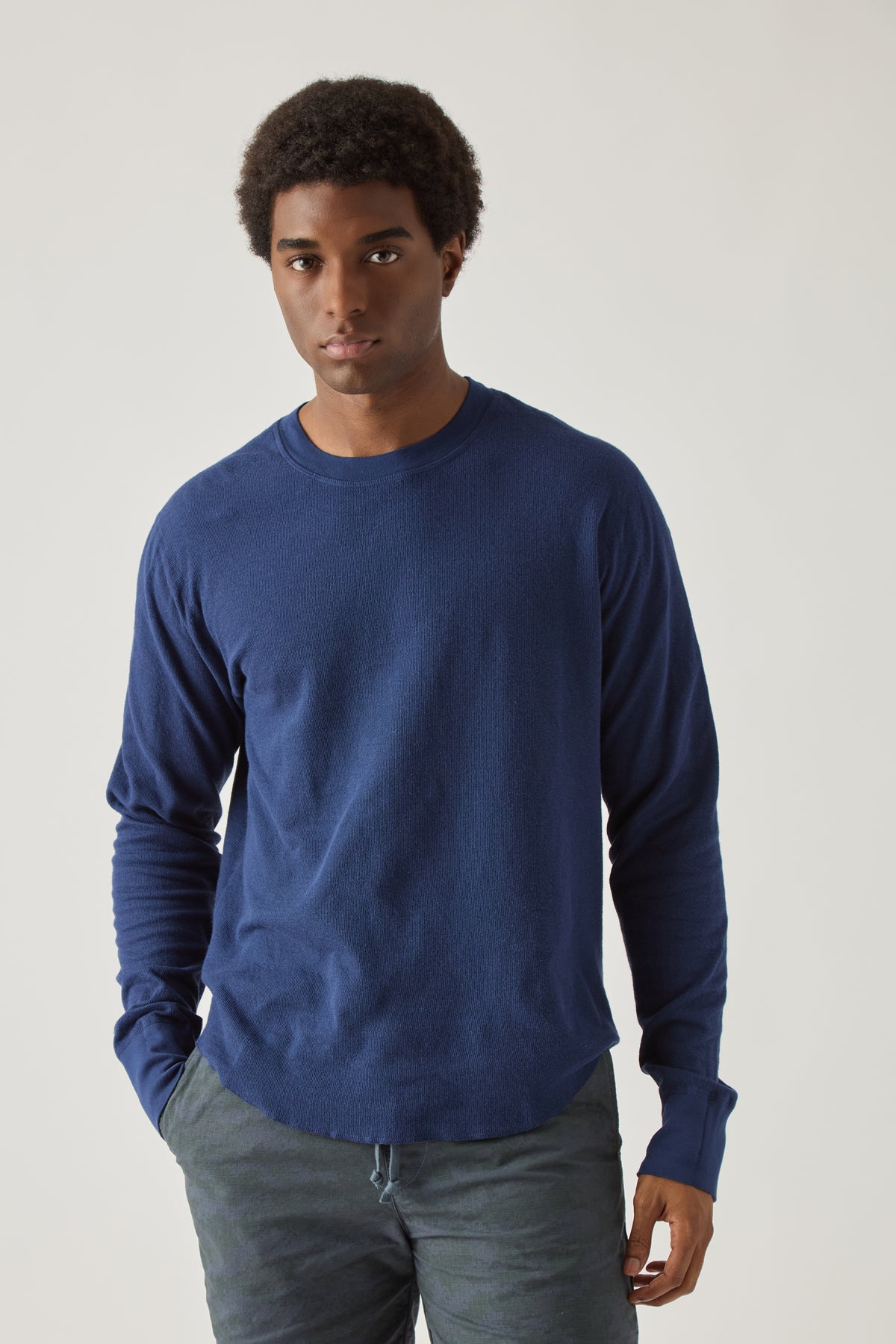 Blue long-sleeve crewneck T-shirt worn by a model