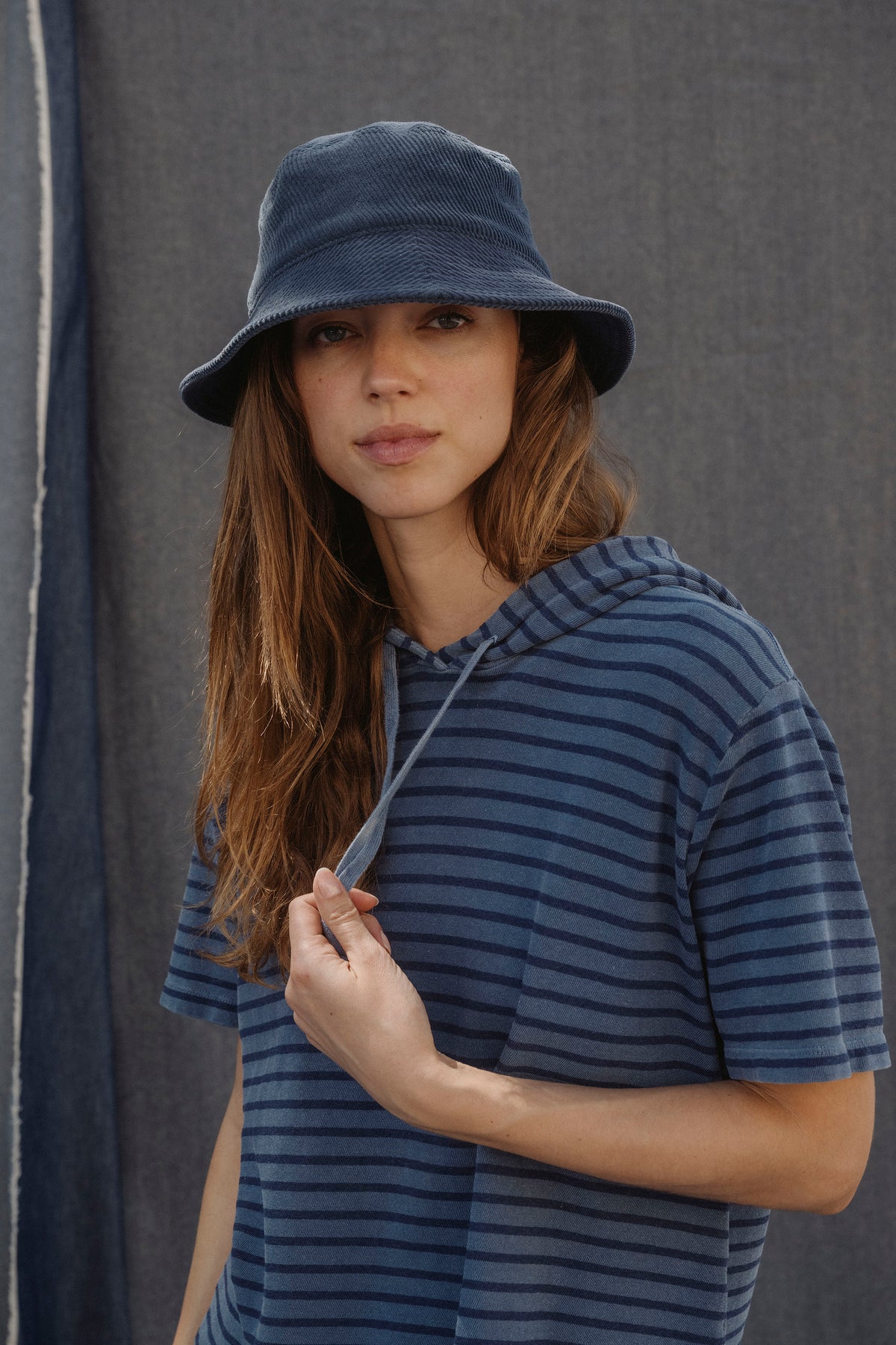 Blue striped hemp hoodie with hood, zipper front, and gray drawstrings