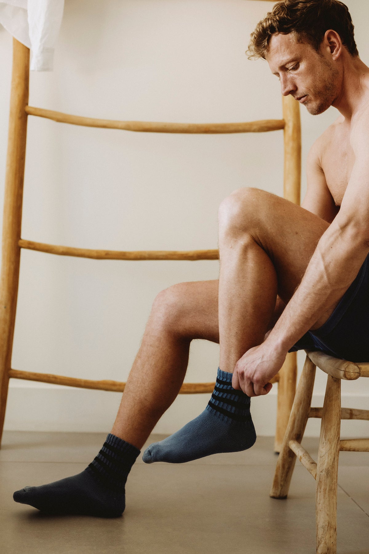 4-pack striped crew socks on feet, navy socks with dark stripe bands