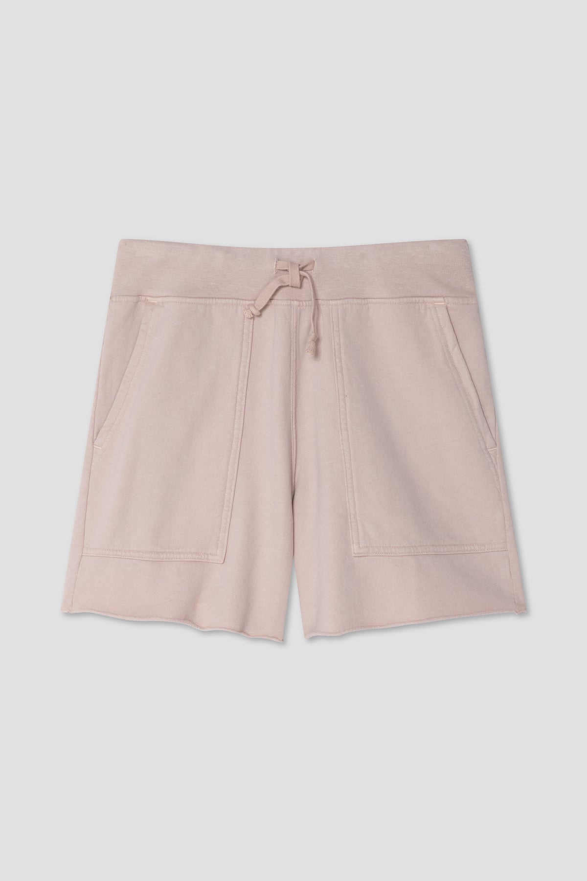Light pink fleece utility shorts with drawstring waist and side pockets