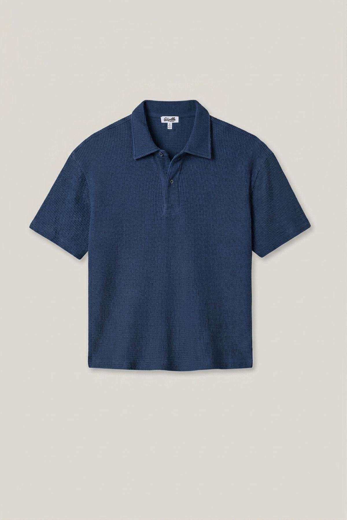 Indigo waffle knit polo shirt with short sleeves, spread collar, and 3-button placket