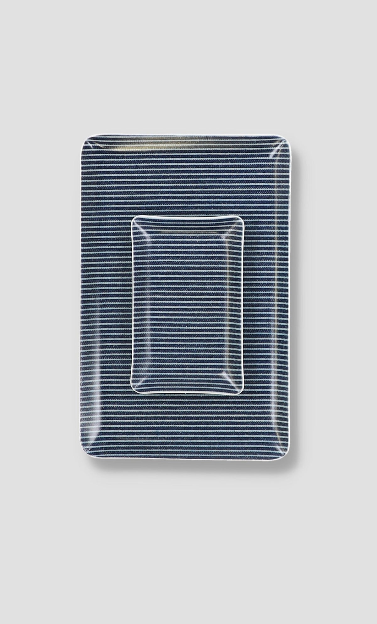 Laminated blue-and-white striped rectangular tray with clear wire tray insert outline